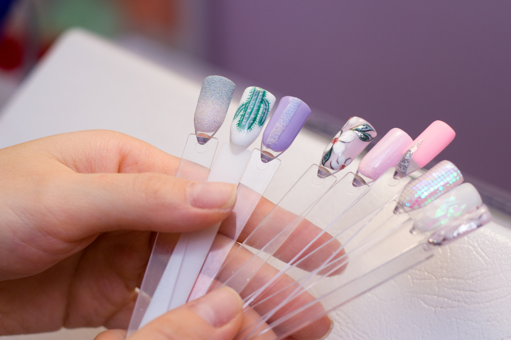 woman-holds-colored-test-nail-polishes-with-different-colors-chooses-color-painting